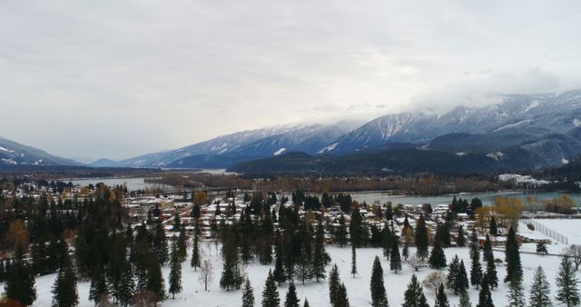 A serene winter landscape showcases a snow-covered valley - Download Free Stock Photos Pikwizard.com