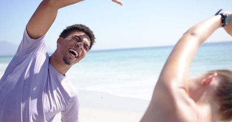 Young Man Enjoying Beach Workout Stretch on Sunny Day