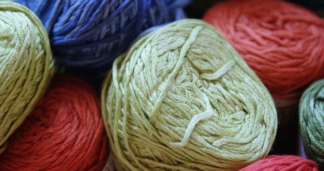 Colorful yarn balls are neatly arranged, showcasing a variety of hues. Ideal for crafting and knitting projects, these yarns inspire creativity and handmade artistry.