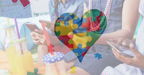 Colorful puzzle heart symbolizing autism awareness with diverse children