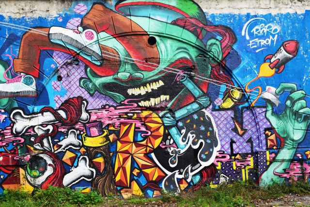 Colorful Abstract Graffiti on Concrete Wall Featuring Vibrant Characters and Street Art Elements - Download Free Stock Photos Pikwizard.com