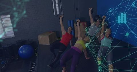 Group Strength Training Holding Single-Arm Dumbbell Planks in Functional Fitness Studio
