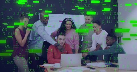 Business Team Collaborating Around Laptop with Green Binary Overlay Suggesting Cybersecurity