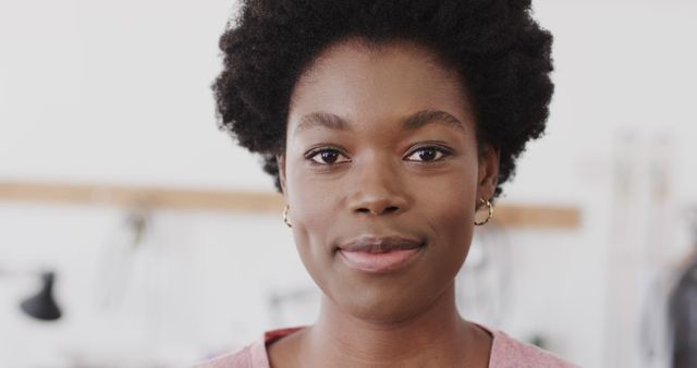 Confident Young African Woman Smiling at Camera in Office - Download Free Stock Images Pikwizard.com