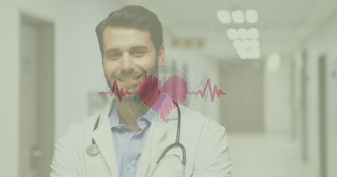 Confident doctor with heartbeat symbol overlay in hospital corridor