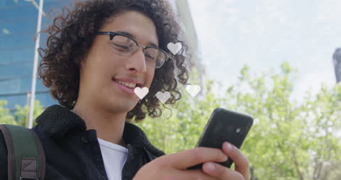 Young Man Enjoying Social Media Interaction on Smartphone