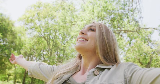 Joyful Woman Embracing Nature in Forested Park - Download Free Stock Images Pikwizard.com