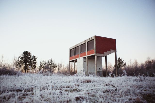 Modern Concrete Building in Frosty Countryside Setting at Dusk - Download Free Stock Photos Pikwizard.com