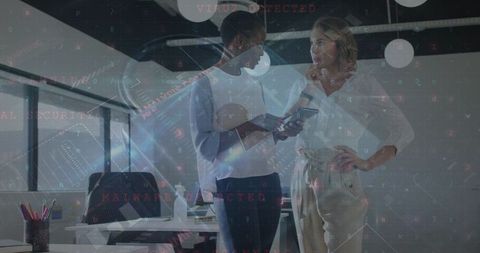 Colleagues Strategizing Cybersecurity Holding Digital Tablet