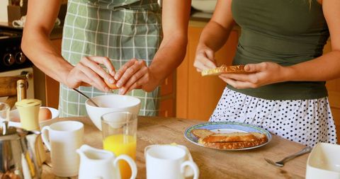 Family Cook Time with Bread and Eggs in Modern Kitchen
