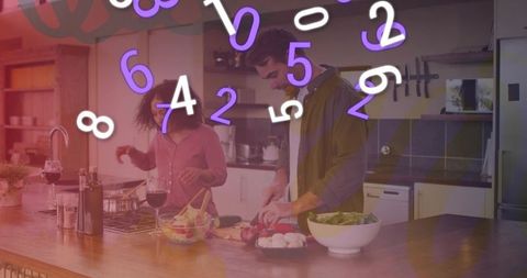 Young couple chopping vegetables at kitchen island with wine and floating numbers overlay