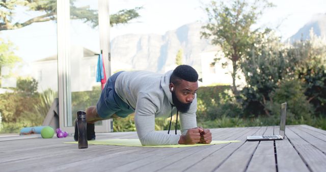 Man Exercising With Online Class Outdoors Planking - Download Free Stock Images Pikwizard.com