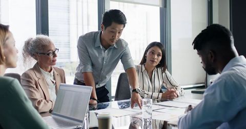 Team discussing business strategy in modern office