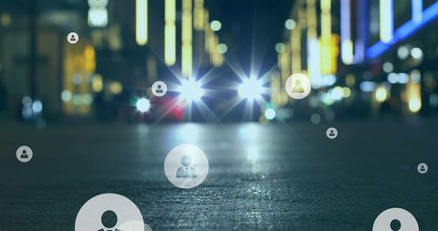 Social Media Icons Overlay on Car Headlights in Nighttime City