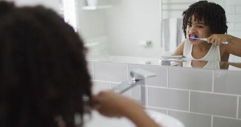 Child Practicing Healthy Dental Hygiene in Modern Bathroom - Download Free Stock Images Pikwizard.com