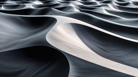 Undulating sand dunes with wavy ridges in desert