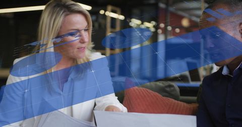 Diverse Colleagues Discussing Progress with Infographic Elements