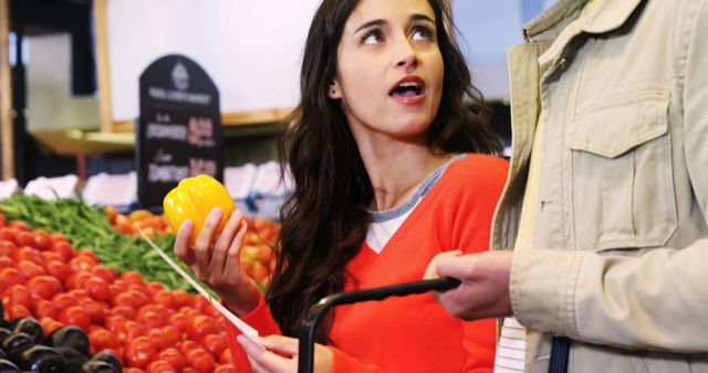 Couple buying vegetables in organic shop at super market