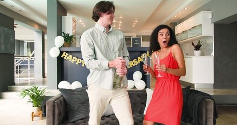 Anniversary Celebration with Cake and Champagne at Home Party