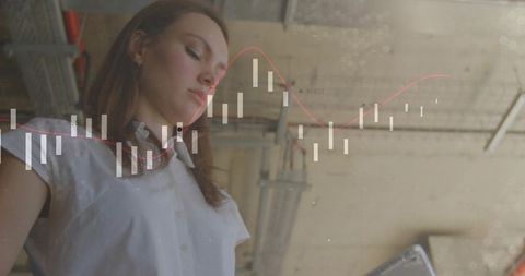 Woman Analyzing Financial Data in Modern Loft Office