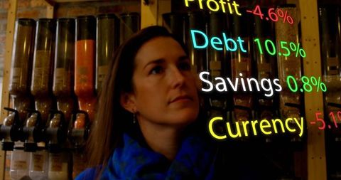 Businesswoman Analyzing Financial Data Viewed on Futuristic Display