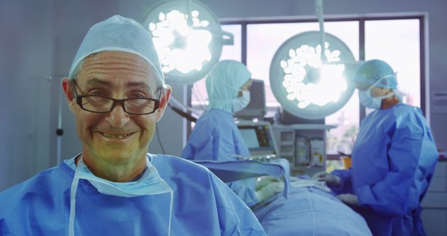 Smiling Surgeon in Operating Room with Surgical Team - Download Free Stock Images Pikwizard.com