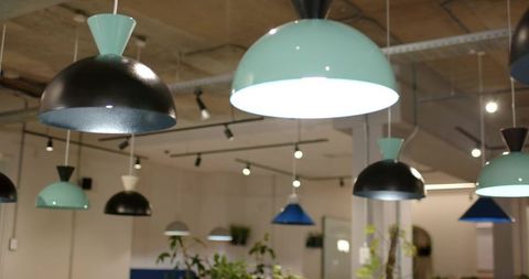 Hanging Mint and Black Dome Pendant Lights in Modern Open-Plan Office with Exposed Ceiling
