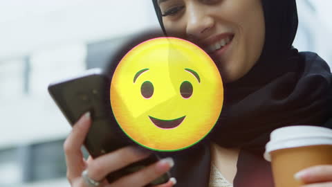 Happy Emoji Overlay on Woman Using Smartphone