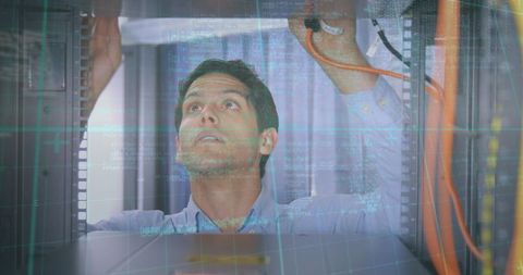 Male Engineer Configuring Server Racks with Digital Data Overlay - Download Free Stock Images Pikwizard.com