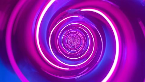 Glowing neon spiral tunnel with concentric light rings