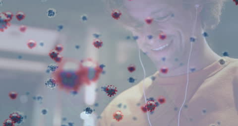 Smiling Man Using Smartphone Amid Floating Covid-19 Cells