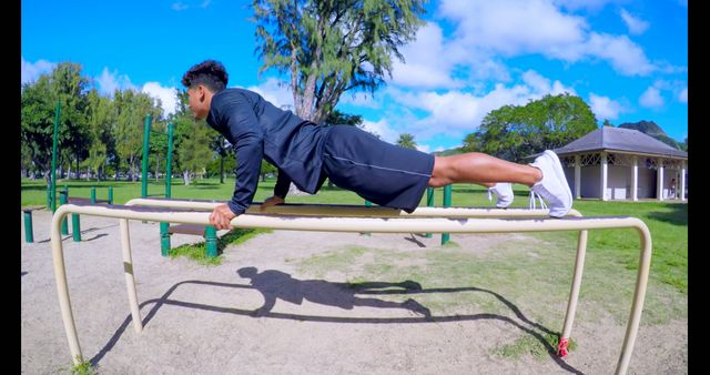 Man Doing Outdoor Workout on Parallel Bars in Park - Download Free Stock Images Pikwizard.com