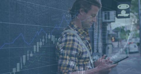 Man analyzing business data on tablet with financial graph overlay