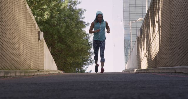 Woman Running in Urban Environment on a Sunny Day - Download Free Stock Images Pikwizard.com