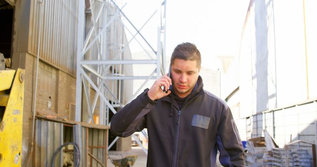 Male Construction Worker Speaking on Phone During Break at Construction Site - Download Free Stock Images Pikwizard.com