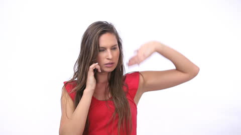 Annoyed Woman Making a Phone Call in Red