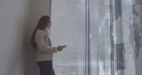 Businesswoman Analyzing Digital Financial Chart in Modern Office