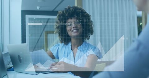 Diverse Professional Analyzing Financial Data Visualization in Office