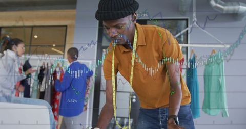 Fashion designer analyzing sketches for innovative collection