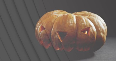 Eerie Three-Faced Jack-o'-Lantern with Subtle Glow - Download Free Stock Images Pikwizard.com