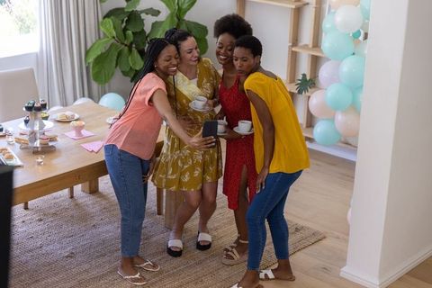 Diverse Group of Female Friends Enjoying Tea Party Selfie