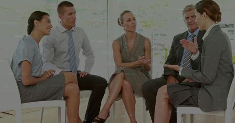 Business Team Holding Executive Meeting in Modern Office Discussing Strategy and Teamwork