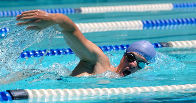 Male Swimmer in Action During Freestyle Stroke at Swimming Pool - Download Free Stock Photos Pikwizard.com