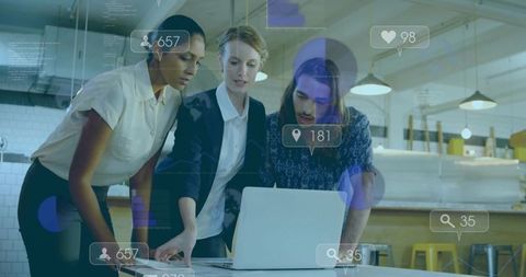 Tech-savvy team collaborating on social analytics in modern office