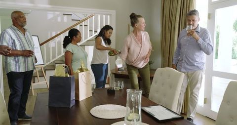 Senior Diverse Friends Enjoying Festive Celebration at Home