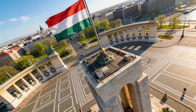 Flying hungarian tricolor flag above millennium monument at heroes square budapest aerial