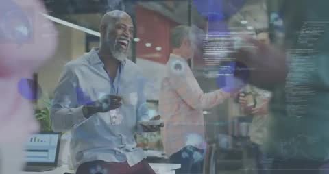 Mature professional laughing and sipping coffee during collaborative office break with data overlays