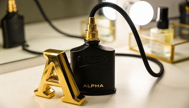 Showcasing matte black creed alpha fragrance bottle with gold atomizer and metallic a