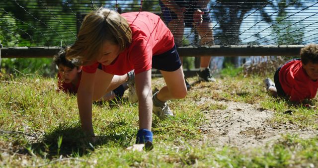 Determined Kids Crawling in Outdoor Obstacle Course Challenge - Download Free Stock Images Pikwizard.com