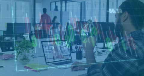 Analyzing Stock Charts During Remote Video Call in Modern Open Office Workspace